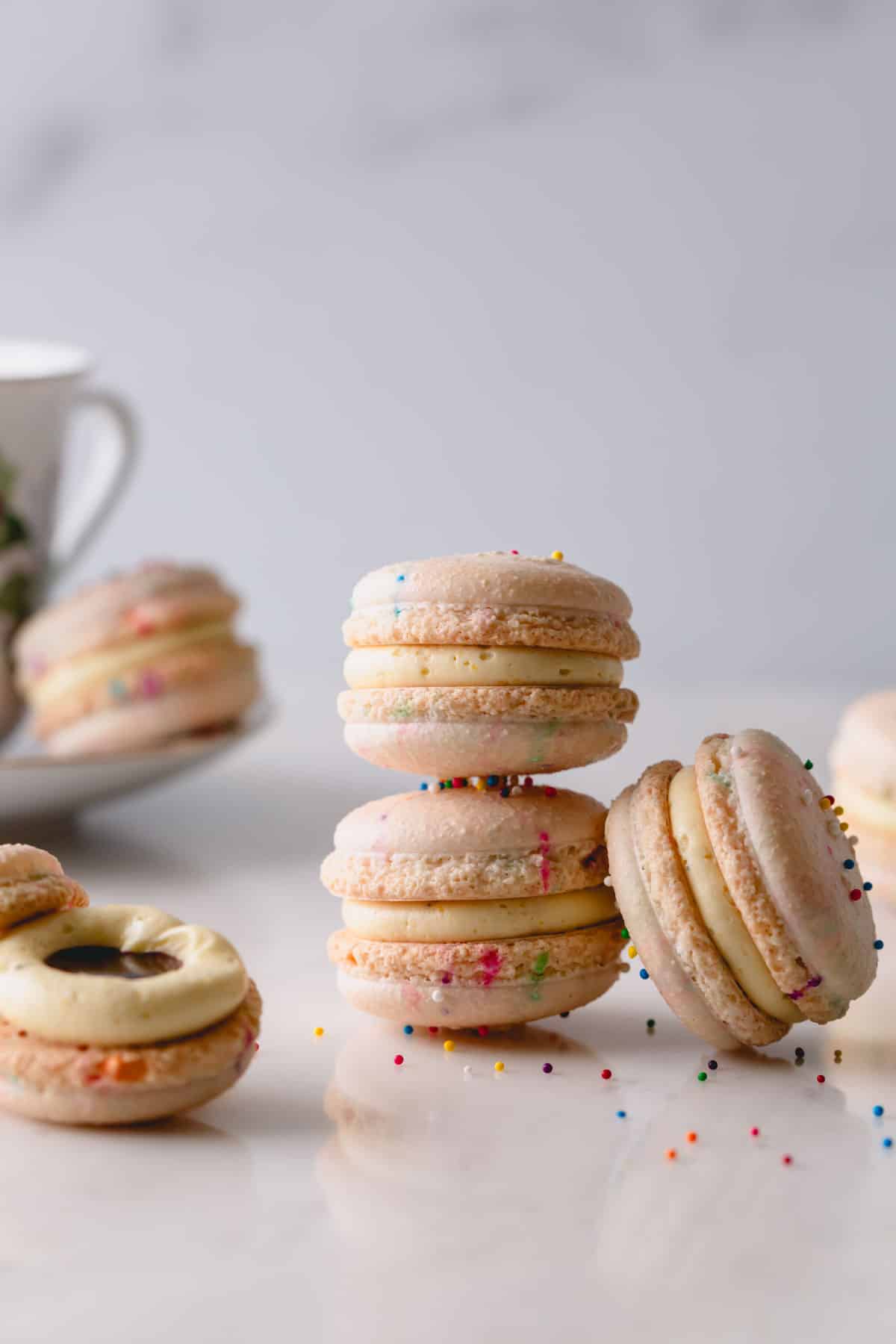 2 funfetti macarons stacked on top of each other.