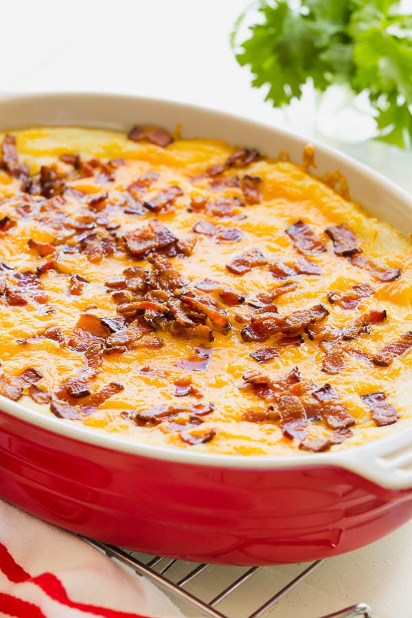 This loaded mashed potato casserole is a perfect make-ahead side dish for a holiday season and feeds an army! Everyone goes for seconds for this one. #mashedpotatocasserole #sidedish #potato #casserole #Thanksgivingsides
