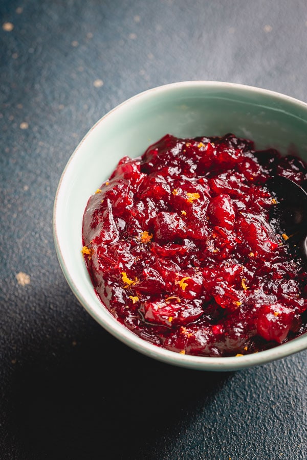 This beautiful cranberry sauce with bright zesty pop of flavor has pure cranberry flavor with just enough sweetness to balance the tartness. #cranberrysauce #Thanksgivingmenu #ThanksgivingRecipes