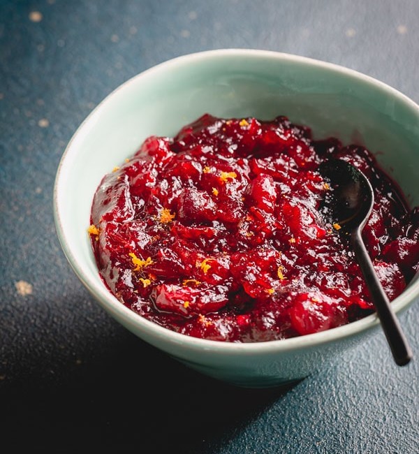 This beautiful cranberry sauce with bright zesty pop of flavor has pure cranberry flavor with just enough sweetness to balance the tartness. #cranberrysauce #Thanksgivingmenu #ThanksgivingRecipes
