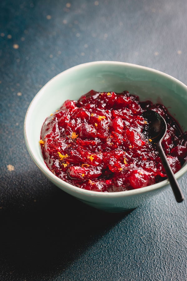 This easy cranberry sauce recipe is a keeper! You'll love the flavor and texture of this orange cranberry sauce. It has a pure cranberry flavor with just enough sweetness to balance the tartness. Plus, you can also make it in an Instant Pot, detailed directions included!  #cranberrysauce #Thanksgivingmenu #ThanksgivingRecipes