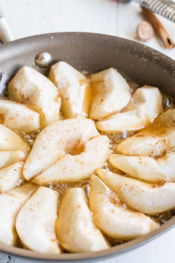 Let the pears simmer in the caramel sauce until they're nice and soft.