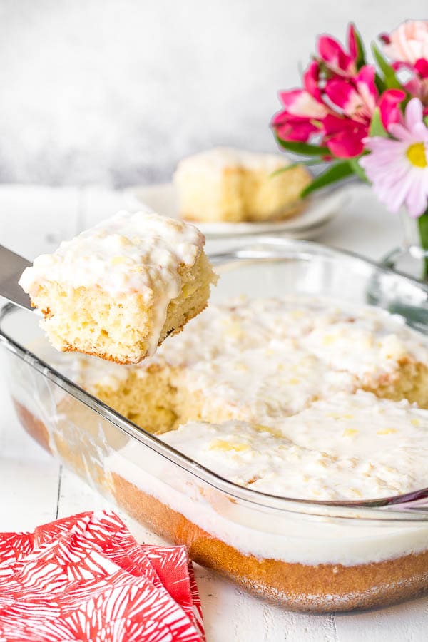 Insanely easy 5-ingredient pineapple cake with pineapple cream cheese frosting! Big reward for very little effort, and feeds a crowd! #pineapplecake #sheetcake #Easterdessert #Eastertreat #dessertforcrowd