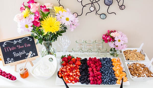 Throwing Spring brunch for a special occasion? Well, I have a great idea for you! Effortless, yet chic this colorful make-your-own-parfait bar is easy to put together and is sure to impress. #brunch #yogurtparfaitbar #brunchmenu #bridalshower #springbabyshower