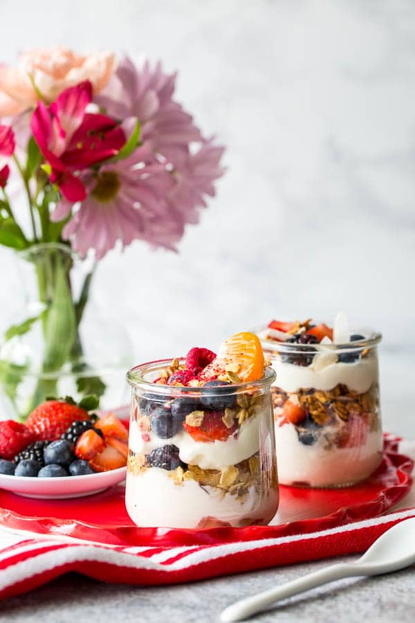 Throwing Spring brunch for a special occasion? Well, I have a great idea for you! Effortless, yet chic this colorful make-your-own-parfait bar is easy to put together and is sure to impress. #brunch #yogurtparfaitbar #brunchmenu #bridalshower #springbabyshower
