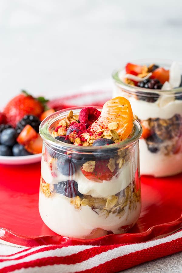 Throwing Spring brunch for a special occasion? Well, I have a great idea for you! Effortless, yet chic this colorful make-your-own-parfait bar is easy to put together and is sure to impress. #brunch #yogurtparfaitbar #brunchmenu #bridalshower #springbabyshower