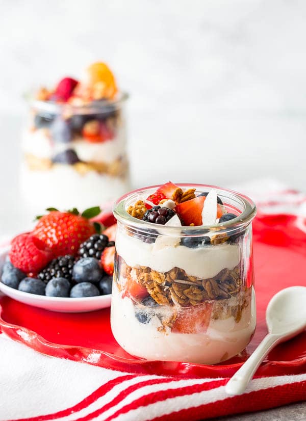 Throwing Spring brunch for a special occasion? Well, I have a great idea for you! Effortless, yet chic this colorful make-your-own-parfait bar is easy to put together and is sure to impress. #brunch #yogurtparfaitbar #brunchmenu #bridalshower #springbabyshower