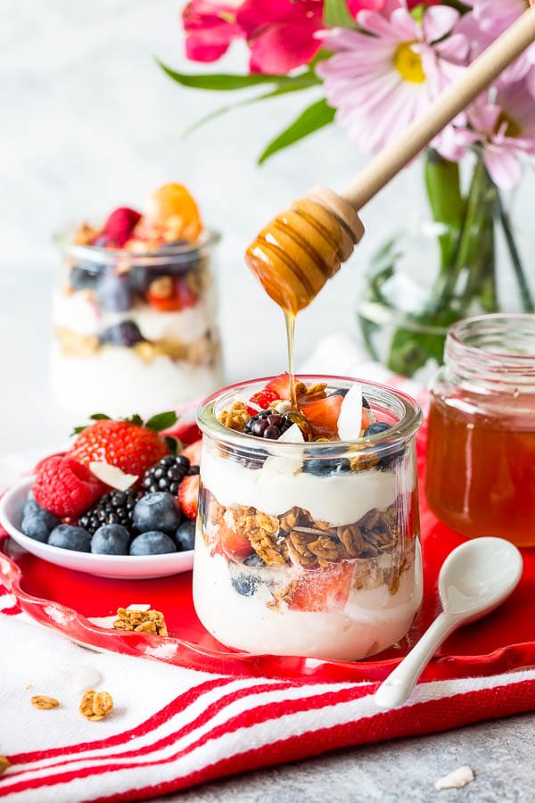 Throwing Spring brunch for a special occasion? Well, I have a great idea for you! Effortless, yet chic this colorful make-your-own-parfait bar is easy to put together and is sure to impress. #brunch #yogurtparfaitbar #brunchmenu #bridalshower #springbabyshower