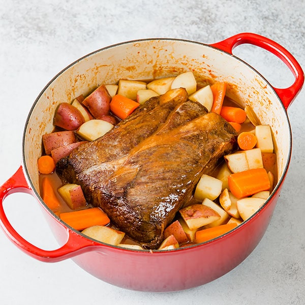 Cooking flavorful, well-marbled chuck roast (I used home-raised wagyu beef) low and slow in a dutch oven yields melt-in-your-mouth tender and unbelievably flavorful pot roast! Easy pot roast recipe for the BEST one pot meal! #potroast #onepotmeal #beefroast #wagyubeef