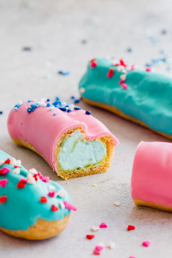 Sprinkle little fun with these cute little gender reveal eclairs to break the news! It's such a sweet way to share fun news. #genderreveal #eclars #genderrevealpartyideas