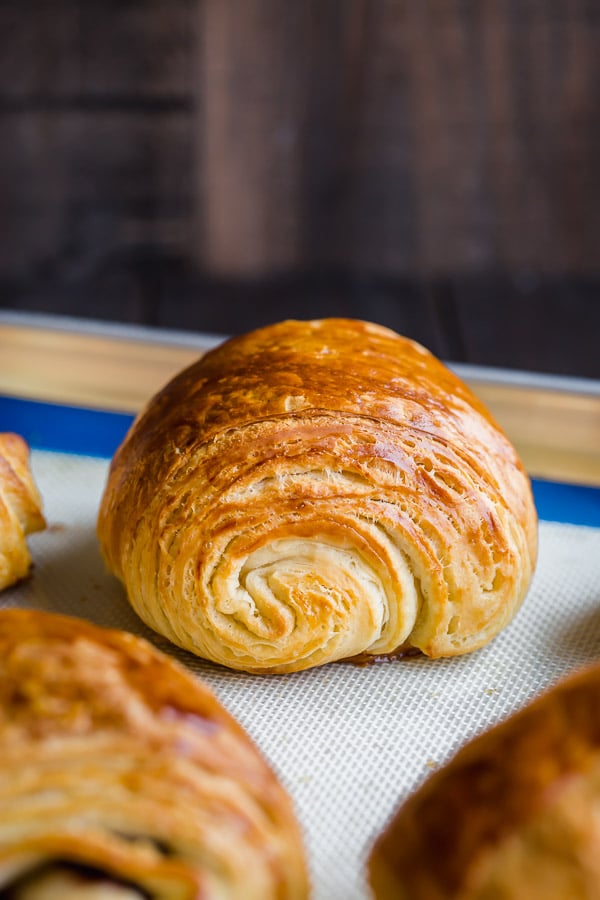 Homemade chocolate croissants from scratch is easier than you may think. You just need a little bit of patience and rolling skills. #painauchocolat #homemadechocolatecroissant #croissant