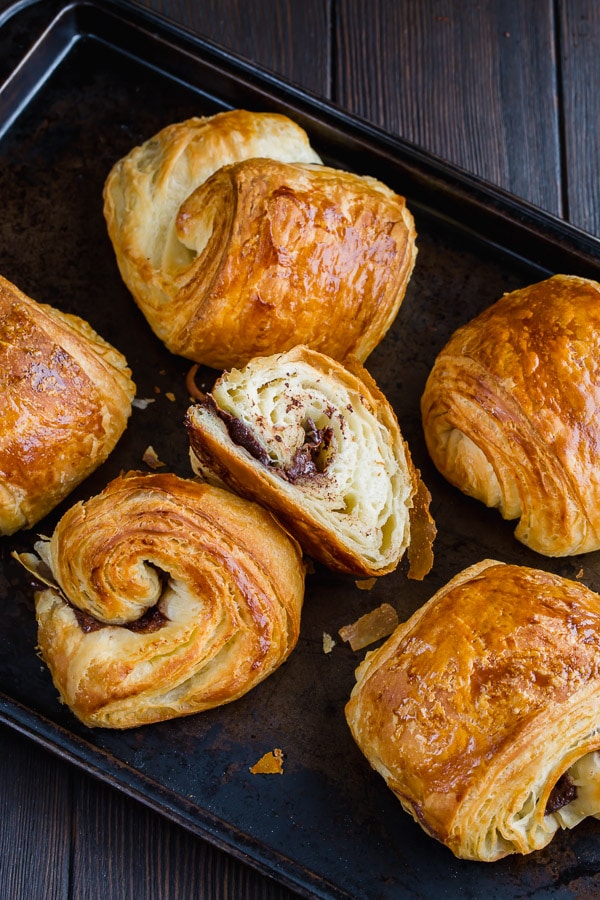 Homemade chocolate croissants from scratch is easier than you may think. You just need a little bit of patience and rolling skills. #painauchocolat #homemadechocolatecroissant #croissant