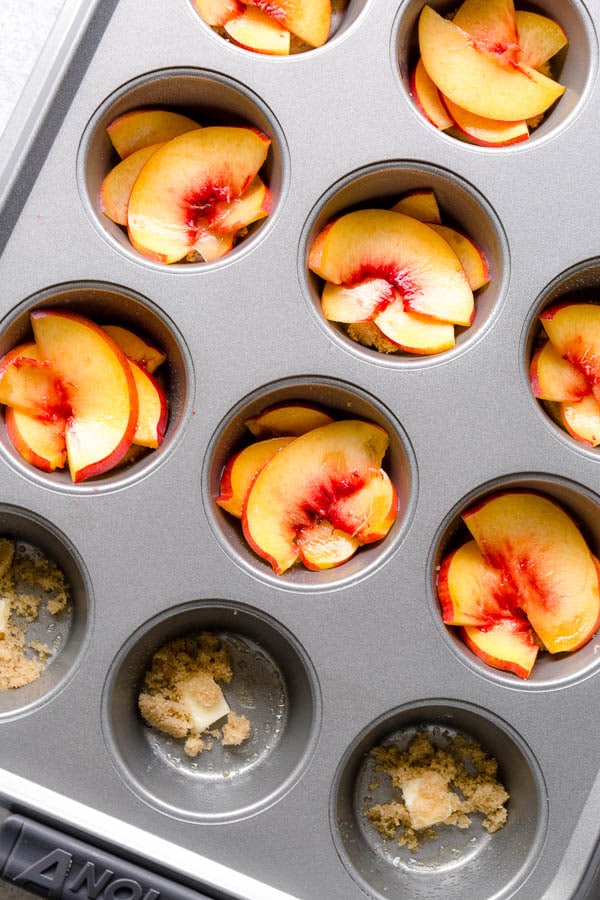 These super moist and tender peach upside down mini cakes are bursting with peaches in every bite. Easy to make, this recipe is a keeper for that indulgent peach season!