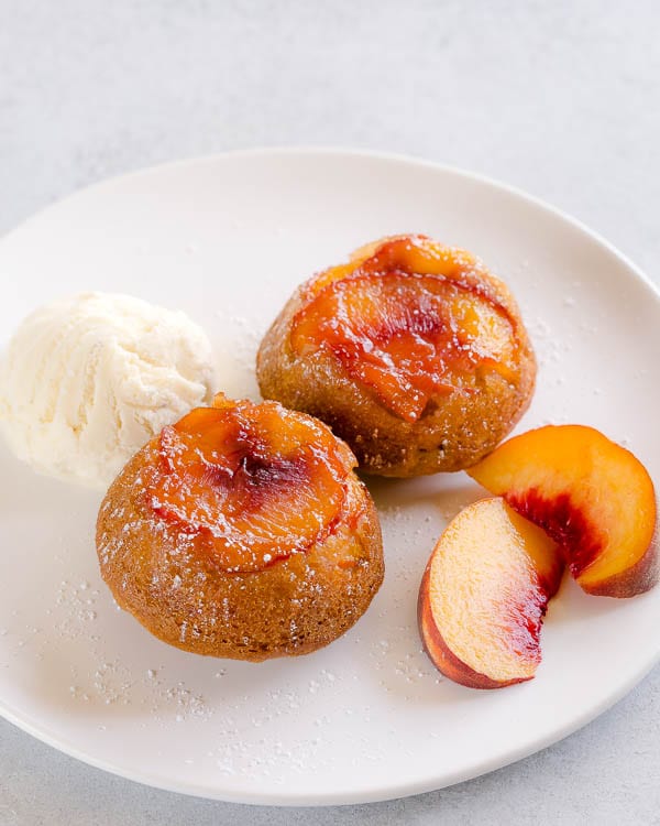 These super moist and tender peach upside down mini cakes are bursting with peaches in every bite. Easy to make, this recipe is a keeper for that indulgent peach season!