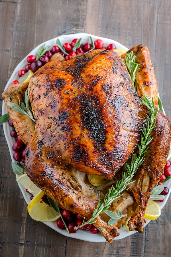 Calling all lemon lovers!!! This lemon herb roast turkey is for you! Infused with tangy lemon butter inside and rubbed with mixture of lemon pepper, garlic & herb seasonings and lemon zest, this roast turkey will surprise your taste buds (in a pleasant way!) this Thanksgiving. #ThanksgivingTurkey #turkey #thanksgivingrecipe #thanksgiving #wholeturkey