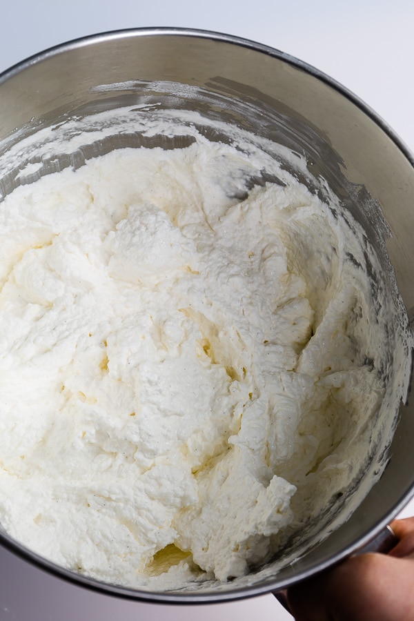 Curdled buttercream in a mixing bowl.
