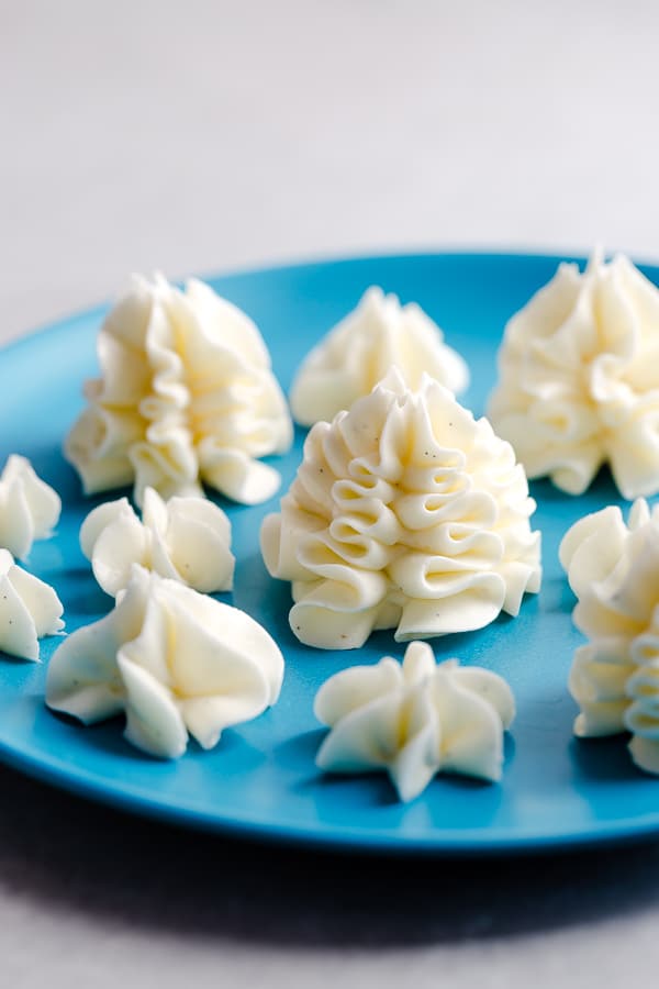 Incredibly light and fluffy, this silky smooth Swiss meringue buttercream is super stable frosting, perfect for piping elaborate designs on any cake. Learn how to make a perfect batch of Swiss meringue buttercream every time with my useful tips and suggestions.