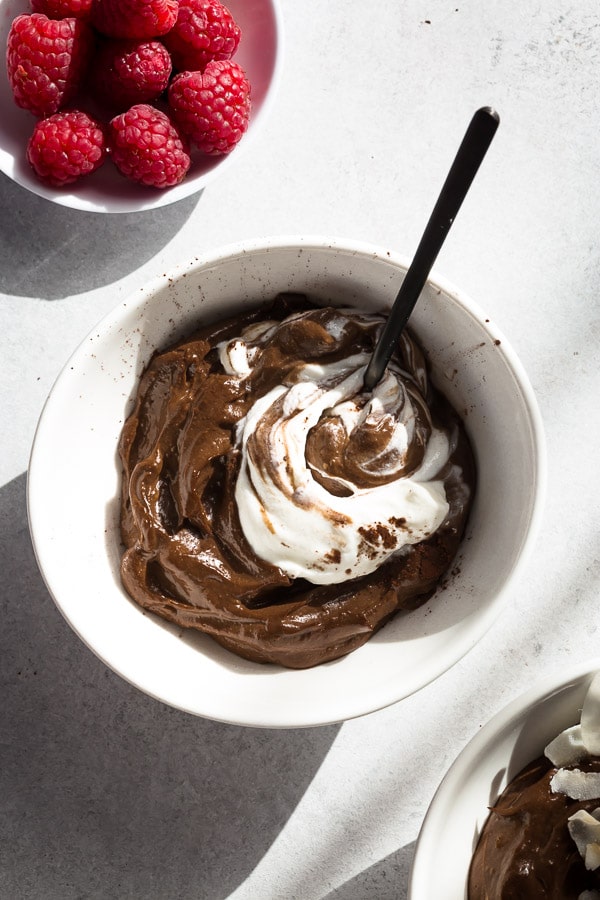 Rich and velvety smooth, this whipped avocado chocolate mousse is quick and easy to make, but tastes so indulgent yet healthy! Plus, irresistible topping ideas included.