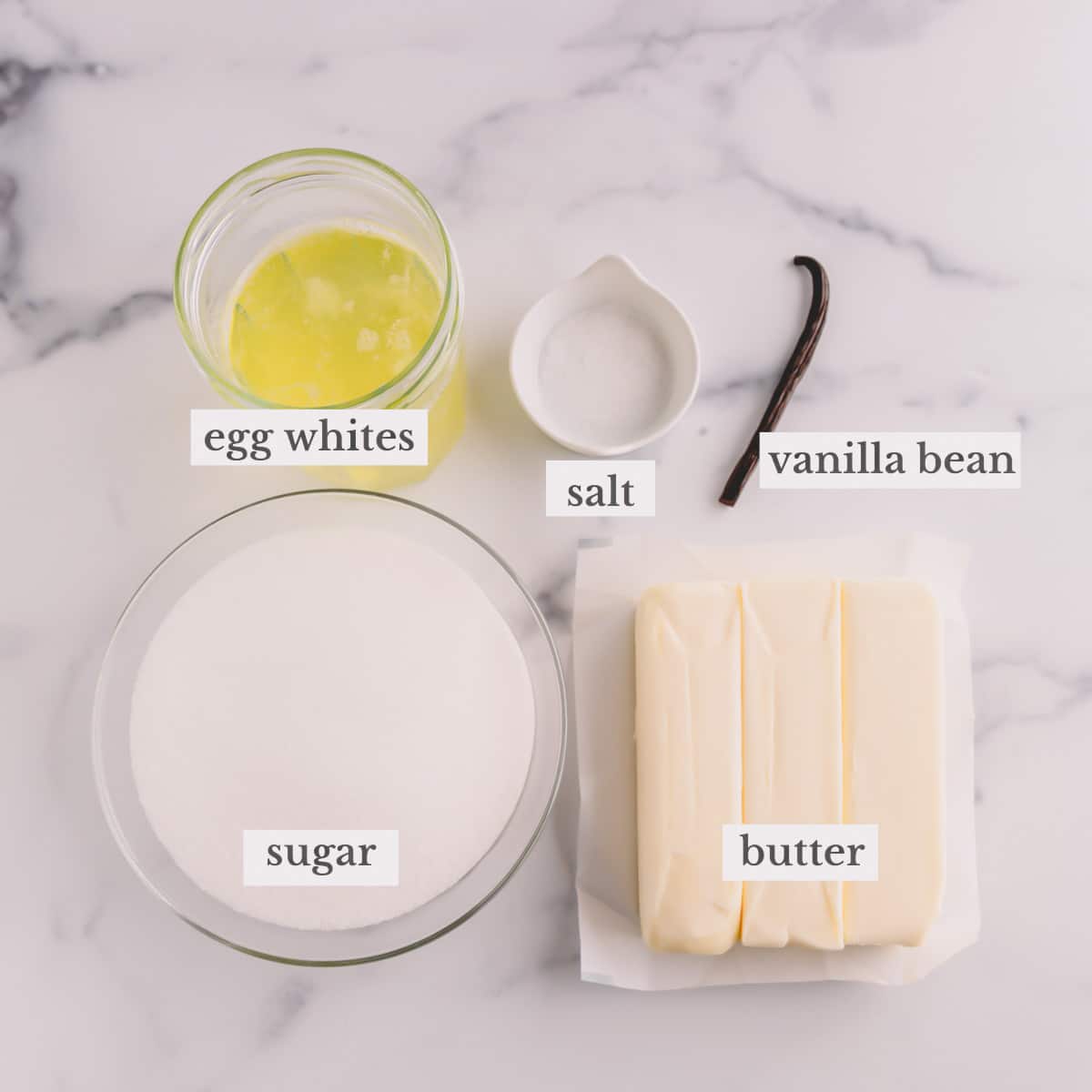 Vanilla swiss meringue buttercream ingredients in individual bowls.