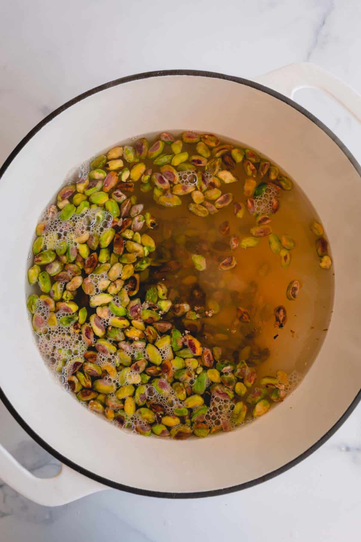 A pot of water with pistachios.