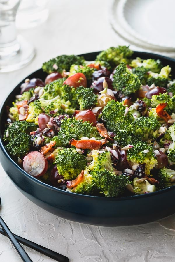 This quick and easy broccoli salad, loaded with flavors and texture, is a perfect side dish for family gatherings and celebrations! Not only is it a delicious crowd-pleaser, it's also great to make it in advance! #broccolisalad #salad