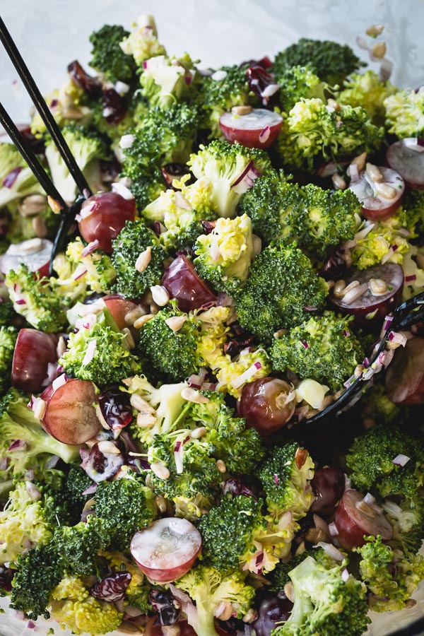 This quick and easy broccoli salad, loaded with flavors and texture, is a perfect side dish for family gatherings and celebrations! Not only is it a delicious crowd-pleaser, it's also great to make it in advance! #broccolisalad #salad