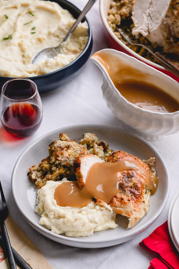 Ultimate Thanksgiving dinner on a small scale, cooked entirely in an Instant Pot in one go! Magic? Nah, just Instant Pot doing its thing!!! So this's what we have on our Thanksgiving menu: Thanksgiving turkey breast with stuffing and mashed potatoes. Plus, gravy!! #Instantpotturkeybreast #thanksgivingdinner #boneinturkeybreast