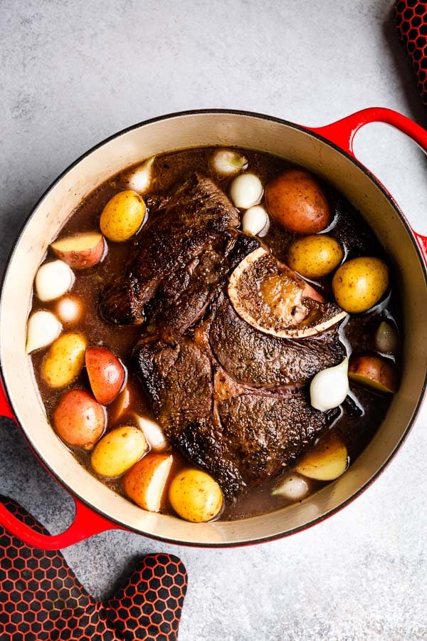 A classic pot roast recipe is perfect for Sunday dinners with enough for leftovers all week long. This recipe is a simple staple for your recipe box! #potroast #beef #chuckroast
