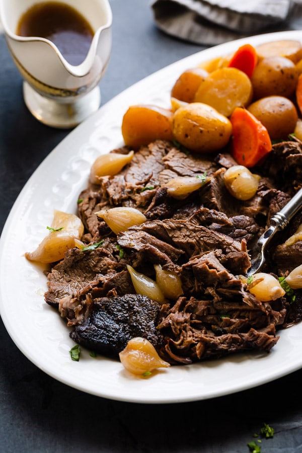 A classic pot roast recipe is perfect for Sunday dinners with enough for leftovers all week long. This recipe is a simple staple for your recipe box! #potroast #beef #chuckroast