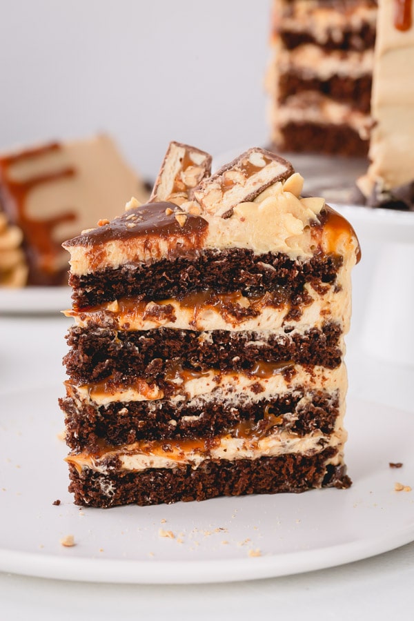 Indulgent Snickers Cake of your dreams!!! So many incredible layers! #snickerscake #layercake #chocolatecake