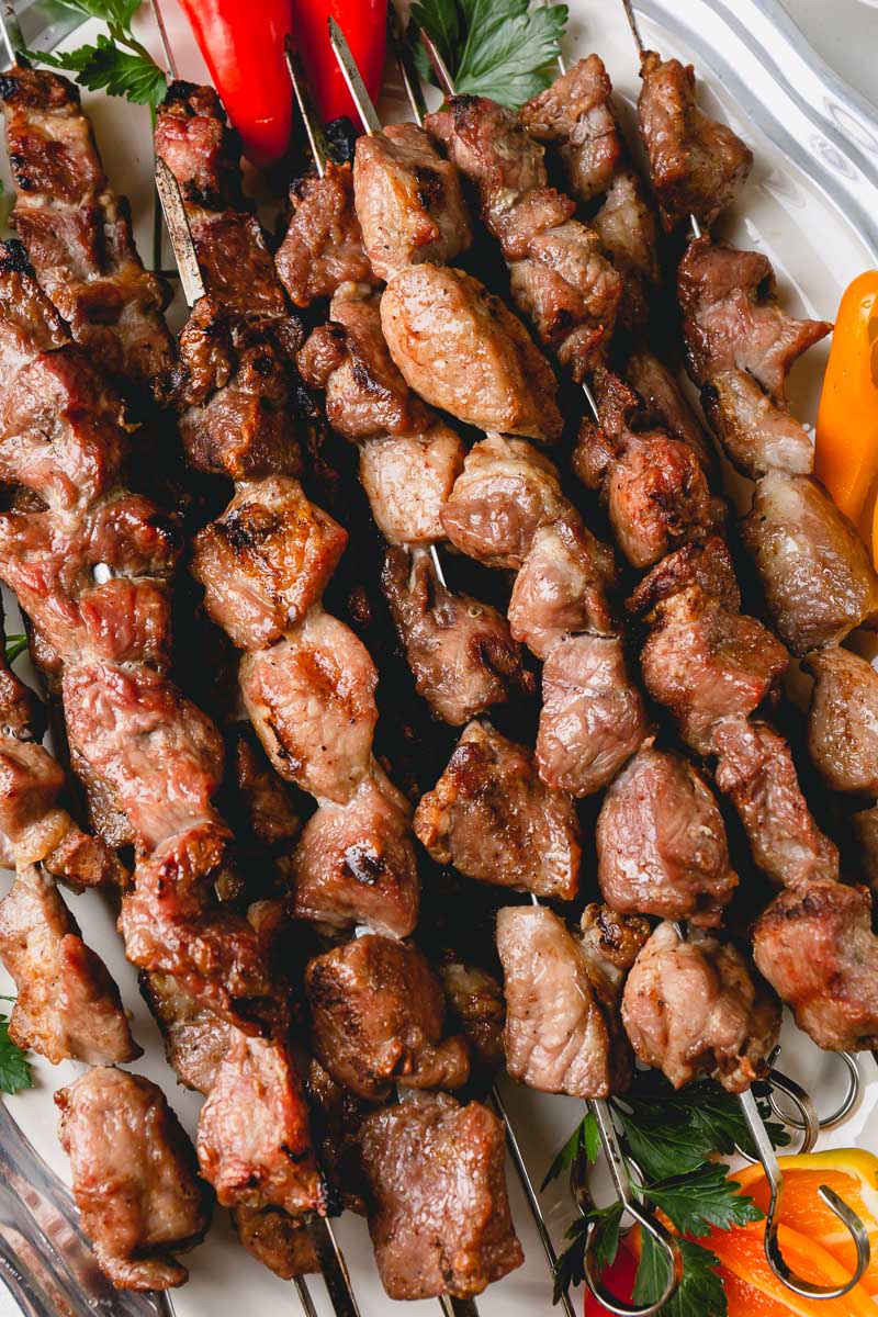 Grilled pork kebabs (shashlik, in Russian) is the summer staple! Here’s how to make the juiciest and most tender grilled pork skewers with simplest marinade. #porkkebabs #shashlik