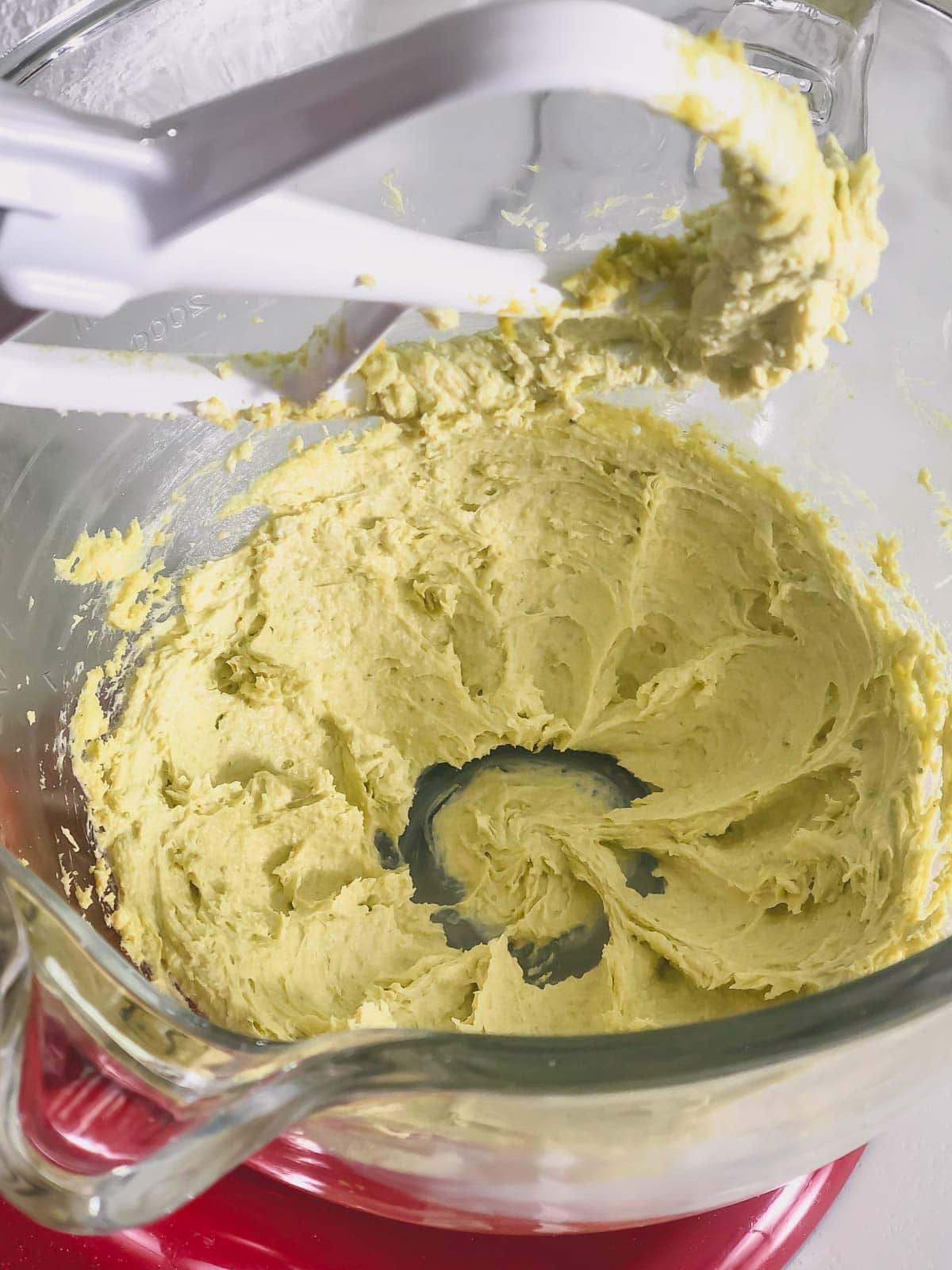 Pistachio buttercream in a mixing bowl.