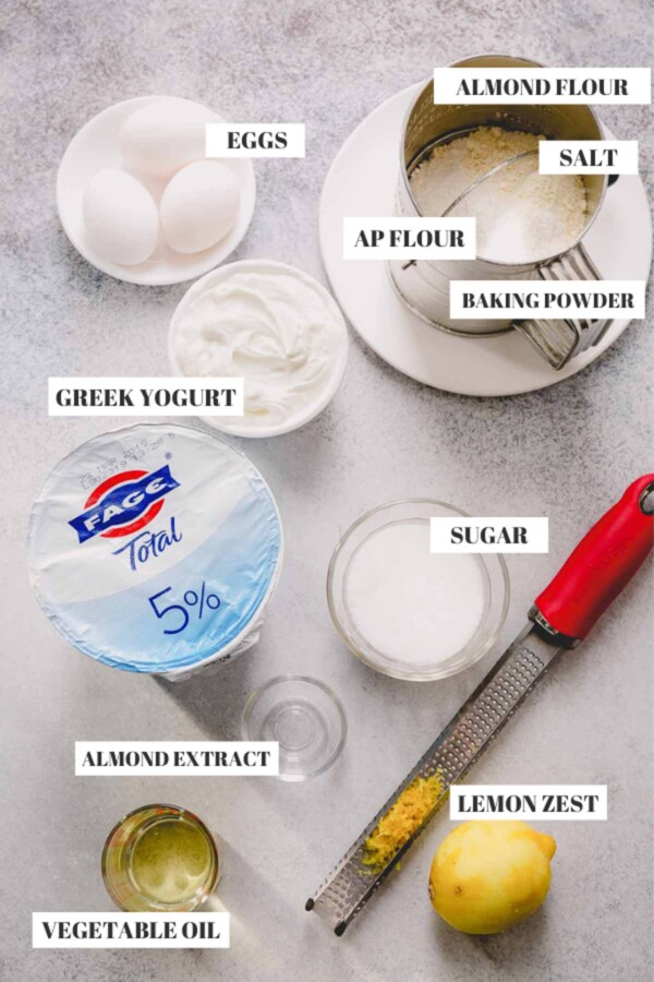 Ingredients for almond cake: eggs, all purpose flour, almond flour, Greek yogurt, vegetable oil, sugar and lemon zest