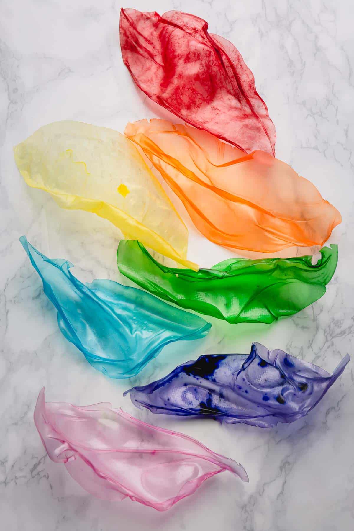 7 rice paper sails of rainbow colors on the counter