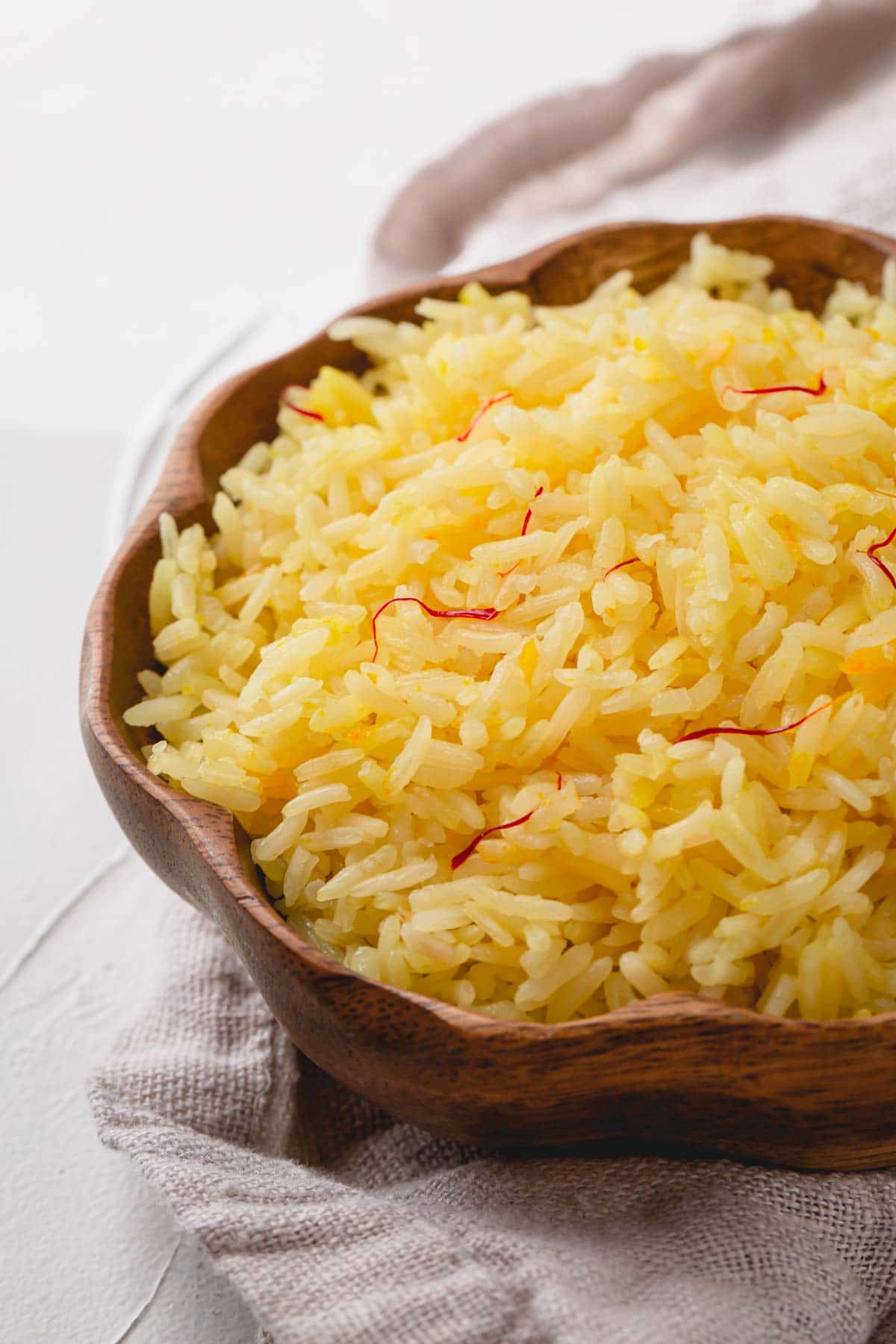 cooked Saffron Rice in wooden bowl