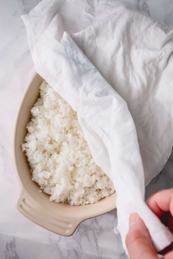 rice covered with a damp towel
