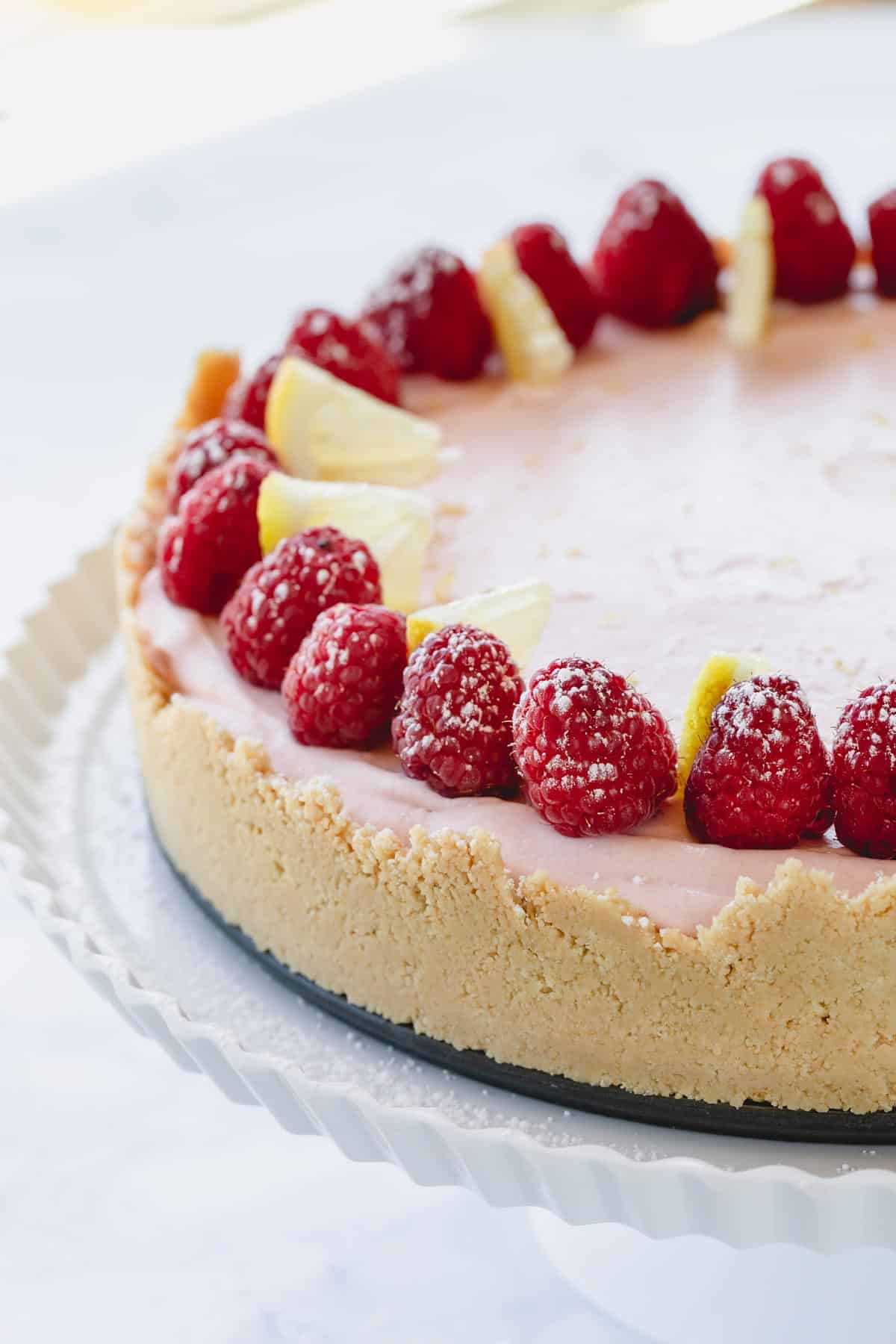 Creamy sweet and loaded with fresh berries, this lemon raspberry no bake ch...