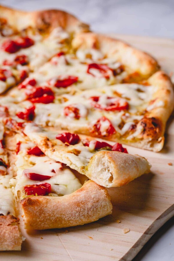 sliced pizza with airy pizza crust.