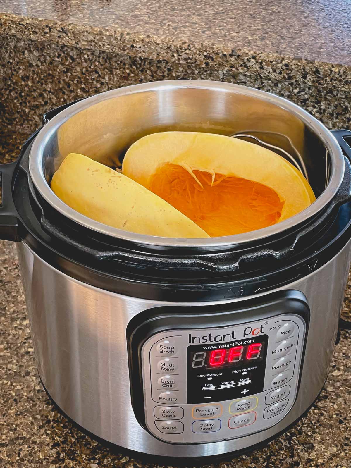 2 spaghetti squash halves in an Instant Pot.