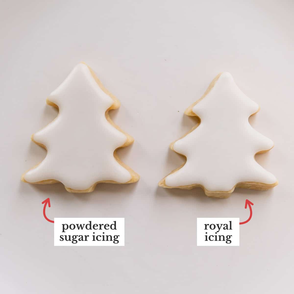 Two Christmas tree shaped sugar cookies with white icing, one roayl icing and the other one is powdered sugar icing.