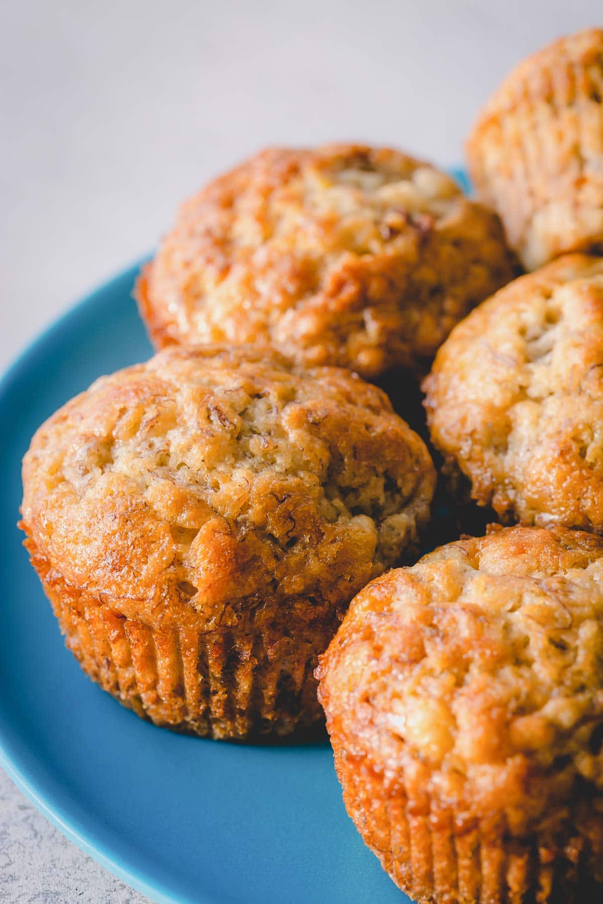 Banana muffins on a blue plate.