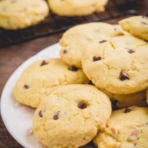 A plate full of chocolate chip cookies.