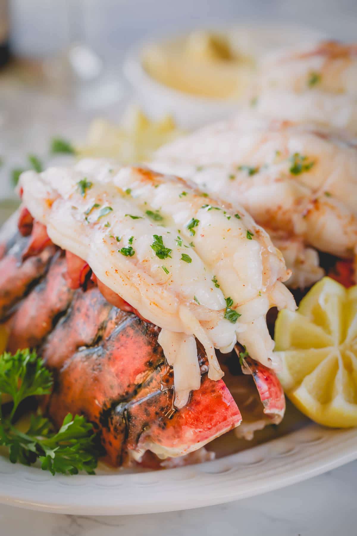 A baked lobster tail on its shell.