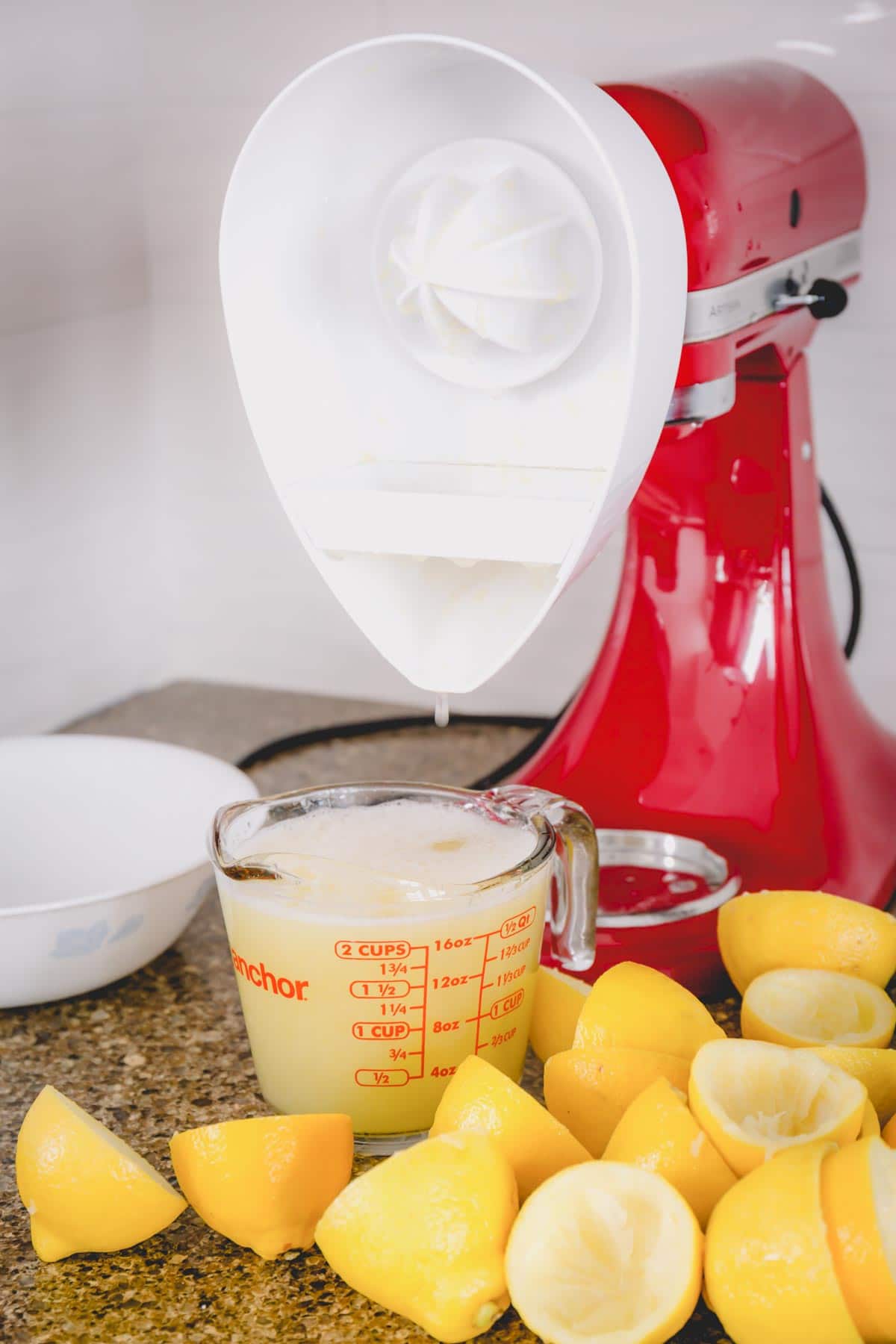 KitchenAid mixer with juicer attachment and freshly squeezed lemon juice.