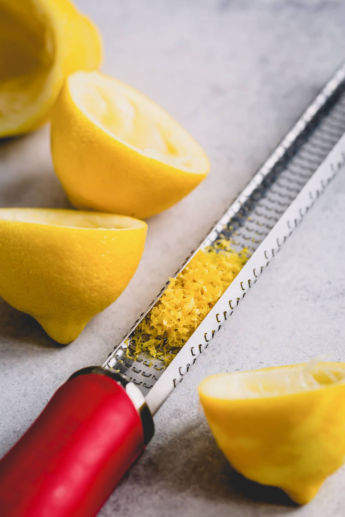 Lemon zest in a hand zester.
