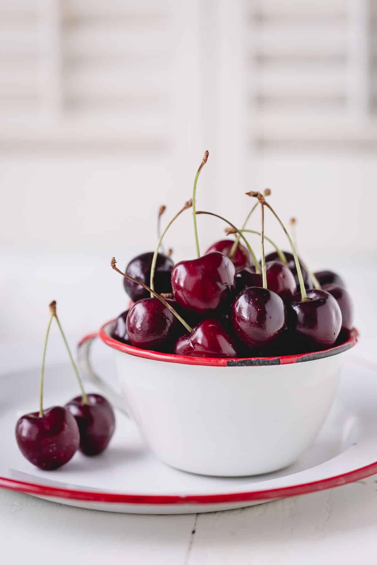 A bowl of dark sweet cherries.