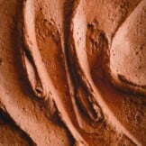 Rich chocolate mousse frosting upclose.