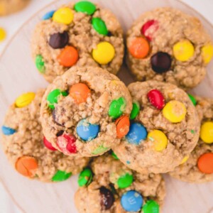 a plate of oatmeal cookies with M&M's