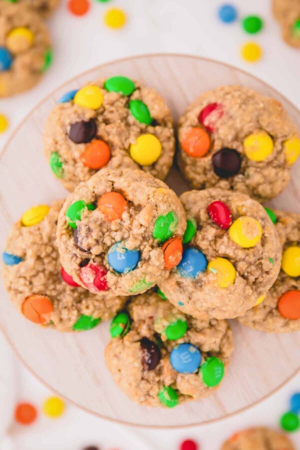 a plate of oatmeal cookies with M&M's