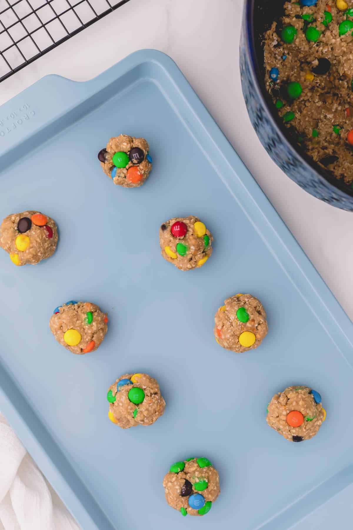 oatmeal cookie dough balls on a sheet pan